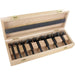 Set of 8 black forstner bits in a wooden box on a white background
