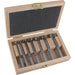Set of drill bits in a wooden case on a white background